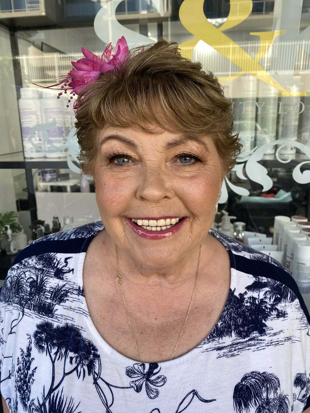 Granny Woman wearing make up with flower in her hair