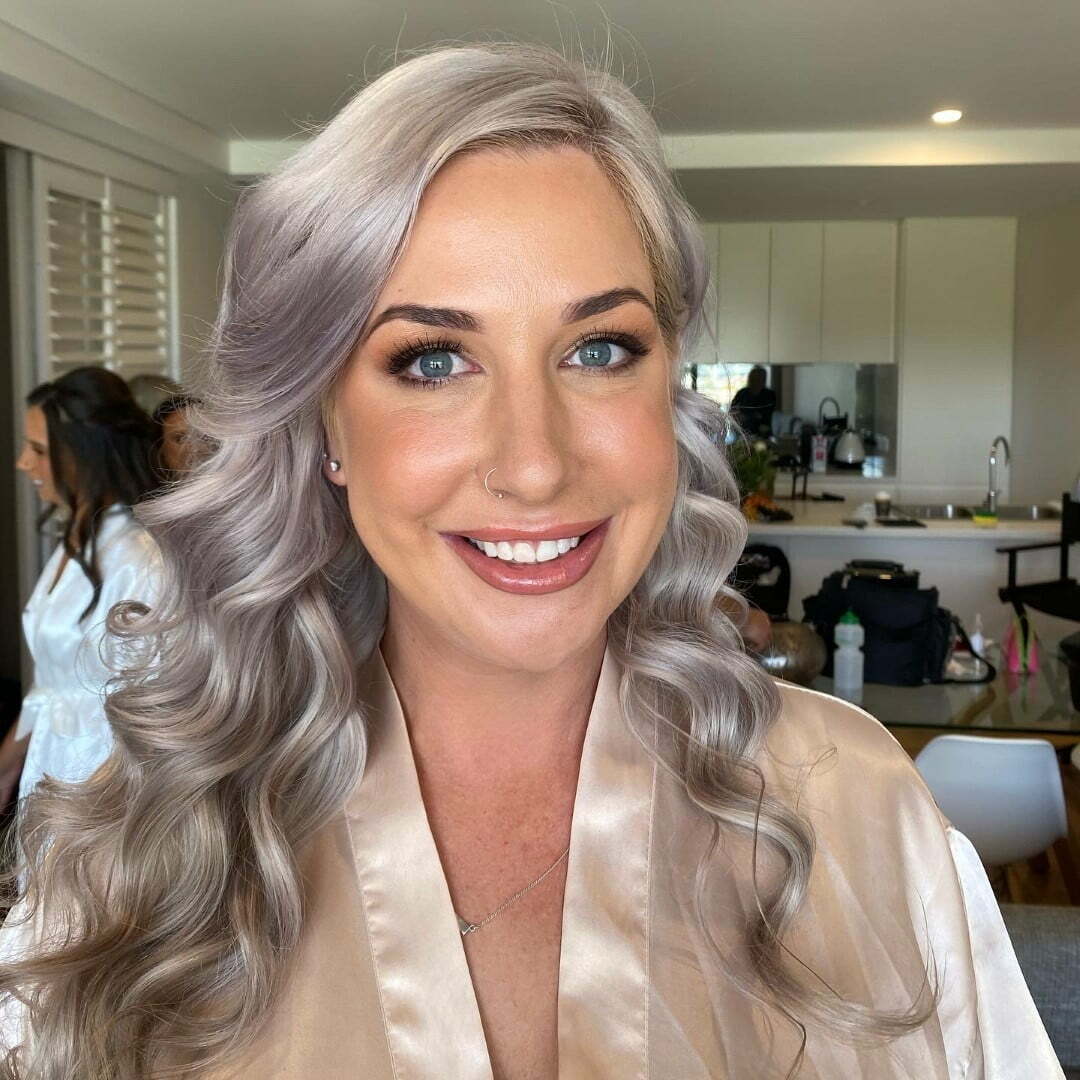 Women wearing make up with ash gray hair color